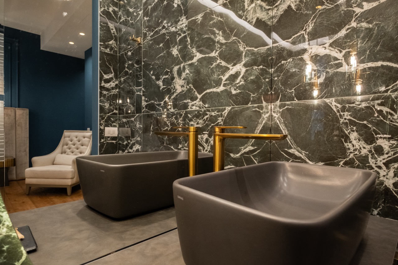 Double vessel sinks with gold faucets