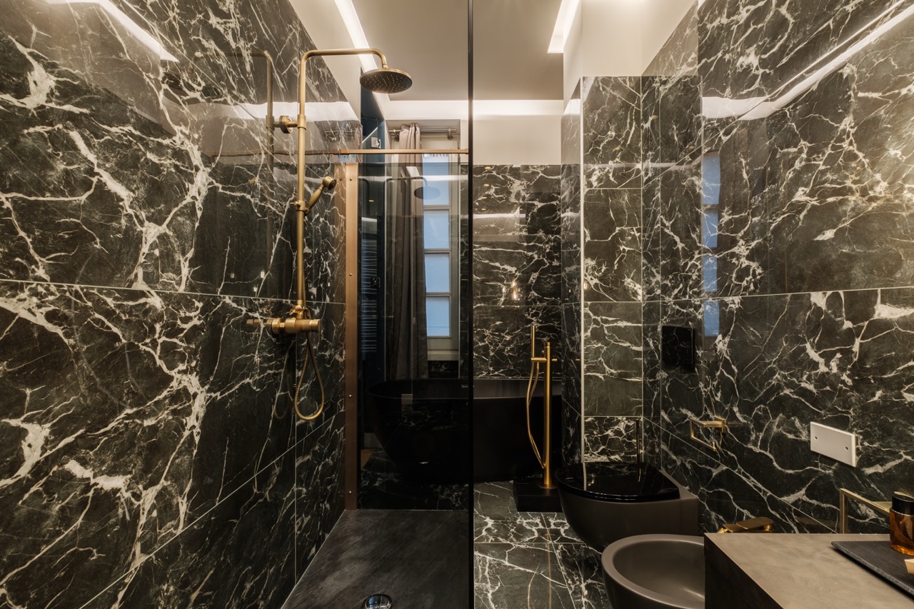 Castello suite dark marble shower