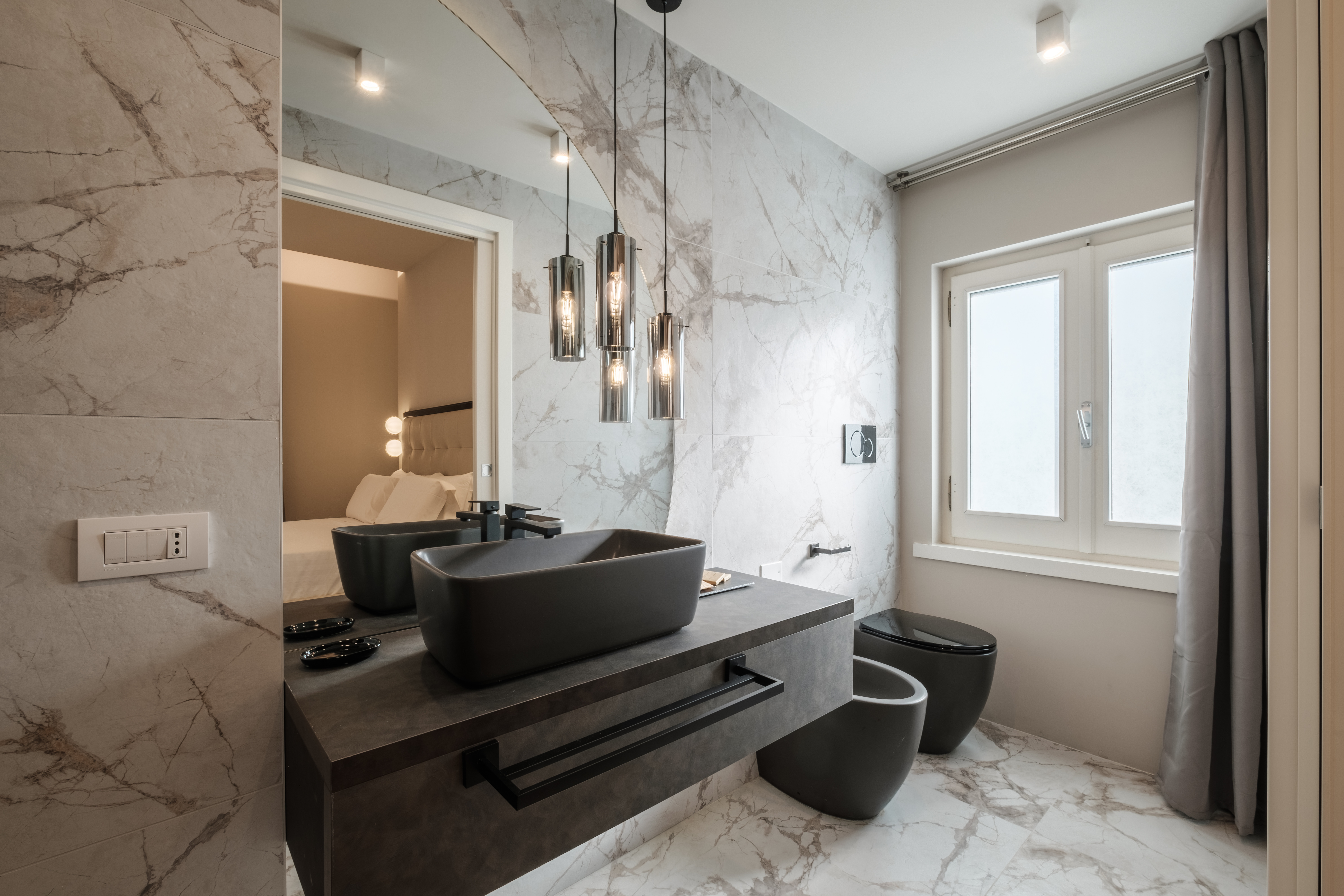 Double vessel sinks with black fixtures